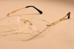 gold rimless frame glasses